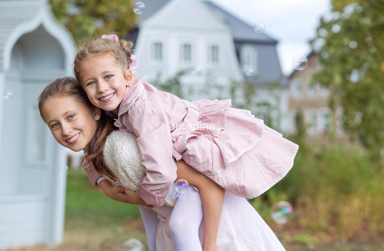 stockfresh_6559351_two-cute-sisters-enjoying-the-autumn-garden_sizeXL_aa2c46